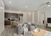 Thumbnail 1 of 37 - a living room and kitchen with couches and a table