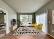 Thumbnail 2 of 33 - an open living room with a white couch and yellow chairs