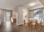 Thumbnail 3 of 11 - the living room and dining room of an apartment with a table and chairs