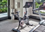 Thumbnail 32 of 35 - a treadmill and exercise bike in the fitness room