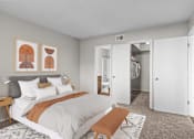 Thumbnail 5 of 37 - a bedroom with a large bed and a closet