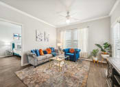 Thumbnail 2 of 53 - a living room with two couches and a coffee table