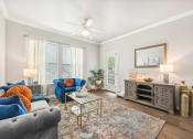 Thumbnail 1 of 53 - a living room with furniture and a ceiling fan