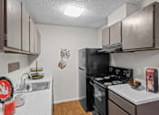 Thumbnail 6 of 18 - a kitchen with a stove top oven next to a sink