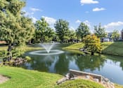 Thumbnail 39 of 52 - a fountain in the middle of a pond
