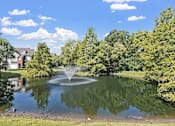 Thumbnail 38 of 52 - a fountain in the middle of a pond