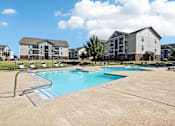 Thumbnail 31 of 36 - the preserve at ballantyne commons pool with apartment buildings