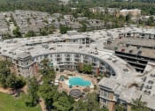 Thumbnail 32 of 36 - an aerial view of a building with a swimming pool