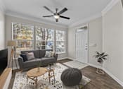 Thumbnail 13 of 52 - a living room with a couch and a ceiling fan