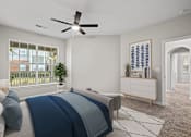 Thumbnail 9 of 52 - a bedroom with a bed and a ceiling fan