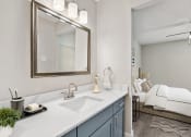 Thumbnail 16 of 41 - a bathroom with a sink and mirror