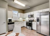 Thumbnail 4 of 33 - a kitchen with stainless steel appliances and white cabinets
