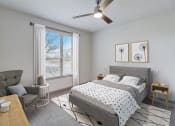 Thumbnail 5 of 44 - a bedroom with a bed and a ceiling fan