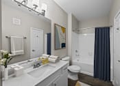 Thumbnail 11 of 52 - a bathroom with a shower and a sink and a toilet