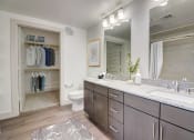 Thumbnail 8 of 44 - a bathroom with a large mirror and two sinks