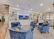 Thumbnail 17 of 36 - the lobby of a spa with blue chairs and a fish tank