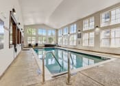 Thumbnail 24 of 36 - the indoor pool is spacious and has windows and a glass railing around it
