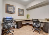 Thumbnail 18 of 36 - a home office with two desks and two chairs