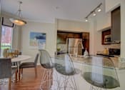 Thumbnail 3 of 34 - a kitchen and dining area in a 555 waverly unit