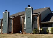 Thumbnail 28 of 29 - a building with two chimneys on the side of it