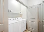 Thumbnail 14 of 36 - a washer and dryer in a laundry room