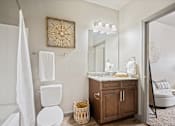 Thumbnail 12 of 36 - a bathroom with a toilet and a sink