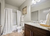 Thumbnail 11 of 36 - a bathroom with a toilet sink and shower
