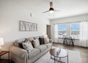 Thumbnail 2 of 33 - a living room with a couch and a coffee table