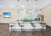 Thumbnail 18 of 33 - the preserve at ballantyne commons clubhouse with bar and chairs