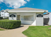 Thumbnail 26 of 40 - the main center is a white building with a sidewalk and grass