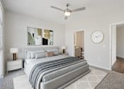 Thumbnail 17 of 55 - A bedroom with ceiling fan.