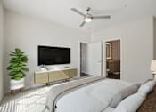 Thumbnail 11 of 55 - A spacious bedroom accommodating a bed and TV console.
