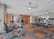 Thumbnail 29 of 33 - a gym with treadmills and other exercise equipment at the enclave at university heights