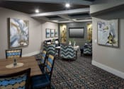 Thumbnail 24 of 28 - a dining room with tables and chairs and paintings