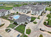 Thumbnail 47 of 55 - an aerial view of a group of houses and a swimming pool