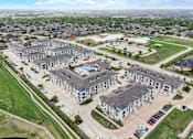 Thumbnail 50 of 55 - an aerial view of a group of houses and a parking lot