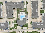 Thumbnail 46 of 55 - an aerial view of a neighborhood with houses and a pool