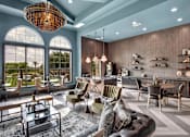 Thumbnail 30 of 35 - Open lounge and bar area with tall windows, mixed seating, and modern finishes.