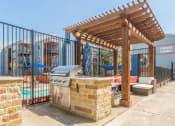 Thumbnail 21 of 21 - a barbecue grill is under a wooden pavilion near a swimming pool