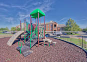 Thumbnail 16 of 25 - A playground with a green roof and a slide.