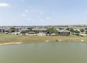 Thumbnail 25 of 25 - A lake in the middle of a residential area.