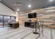 Thumbnail 12 of 21 - the lobby of a building with a bar and a television