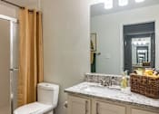Thumbnail 19 of 42 - a bathroom with a toilet sink mirror and shower