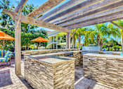 Thumbnail 25 of 42 - a backyard with a hot tub and a pergola