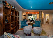 Thumbnail 25 of 45 - a living room filled with furniture and a blue ceiling