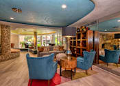 Thumbnail 16 of 45 - a living room filled with furniture and a large window