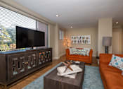 Thumbnail 7 of 45 - a living room filled with furniture and a flat screen tv