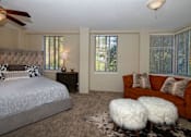 Thumbnail 12 of 45 - a bedroom with a bed and a couch