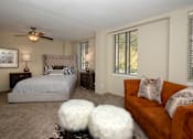 Thumbnail 11 of 45 - a bedroom with a bed and a ceiling fan
