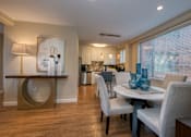 Thumbnail 3 of 45 - a dining room with a table and chairs